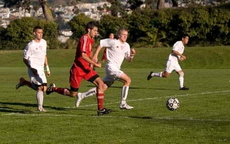 Allen LaSpina and Las Positas Hawk's players race in an attempt to recapture possession of the ball. TRISTAN CRANE / THE GUARDSMAN