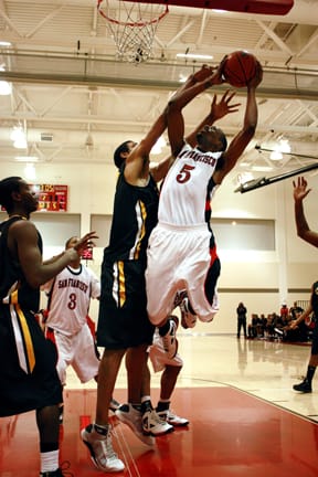Forward Chris White gets fouled on a shot attempt against Chabot on Feb. 5 at the Wellness Center. PHEONIX MARIE / THE GUARDSMAN