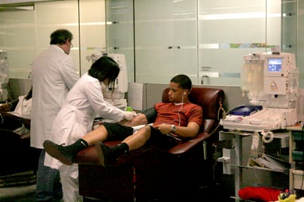 Freshman cornerback Anthony Woods prepares to have his blood draw at Blood Centers of the Pacific Irwin Center in San Franciscon on March 17. AARON TURNER / THE GUARDSMAN