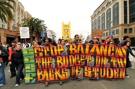 City College students march towards the State Capitol to rally against cuts to education on March 22. Thousands of students, teachers and faculty from state colleges and universities gathered on the steps at the State Capitol. MING LIM DICKSON LO / THE GUARDSMAN