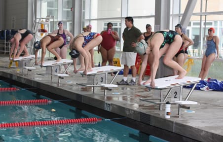 City College swimmers prepare to dive off their starting blocks and swim laps during a practice Feb. 18 at the natatorium inside the Wellness Center. AARON TURNER / THE GUARDSMAN