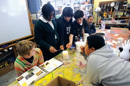 (L-R) Landon Boren, Jasmin William, Mario Canul, Dan Bragss, Dan Sudran and Luis Gallardo (front right) experiment with fire and oxygen at the Mission Science Workshop on May 10. The City of San Francisco plans cut funding to the workshop and some other youth-service programs. ROBERT ROMANO / THE GUARDSMAN