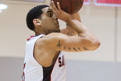 San Francisco Rams sophomore guard Kori Babineaux (5) jump shots against the Ohlone College Renegades in a CCCAA men’s basketball game on Ocean campus, Friday, Feb. 22, 2014. The Rams won the game 71-63, finishing the regular season 12-0 undefeated. They won the Coast-North Conference title and will compete in playoffs next week. Photo by Santiago Mejia/The Guardsman