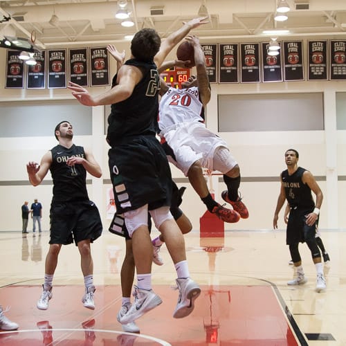 San Francisco Rams freshman guard Vincent Golson (20) shoots a free throw and the final point of the CCCAA men’s basketball game against the Ohlone College Renegades on Ocean campus, Friday, Feb. 22, 2014. The Rams won the game 71-63, finishing the regular season 12-0 undefeated. They won the Coast-North Conference title and will compete in playoffs next week. Photo by Santiago Mejia/The Guardsman