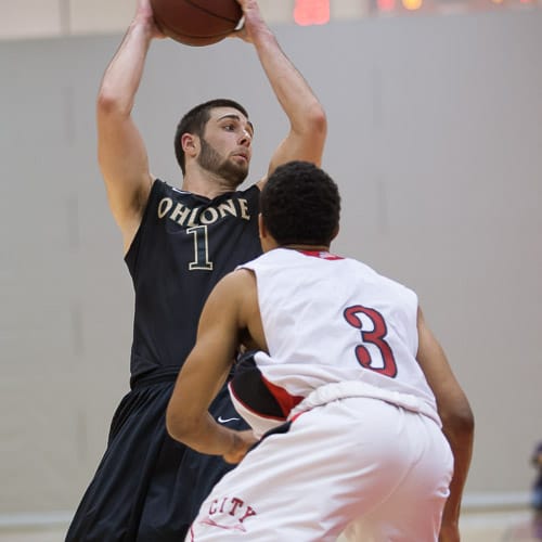 Ohlone College Renegades sophomore Casey Norris (1) keeps the ball away from the San Francisco Rams in a CCCAA men’s basketball game on Ocean campus, Friday, Feb. 22, 2014. The Rams won the game 71-63, finishing the regular season 12-0 undefeated. They won the Coast-North Conference title and will compete in playoffs next week. Photo by Santiago Mejia/The Guardsman