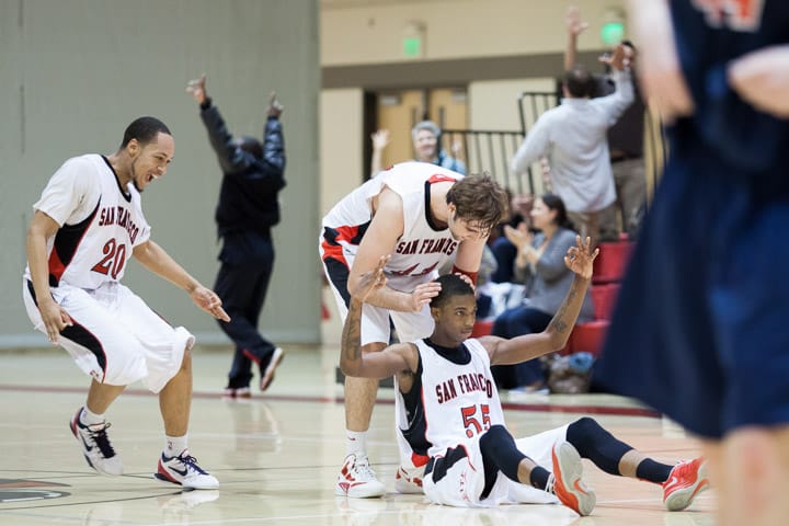 (L-R) In this March 9, 2013, file photo - City College Rams Joseph Slocum (20) reacts and Gabriel Aguirre (44) kisses the head of Delon Wright (55) after Wright scored a half-court three-point shot at the buzzer during a CCCAA basketball game against Santa Rosa College. Photo by Santiago Mejia/The Guardsman