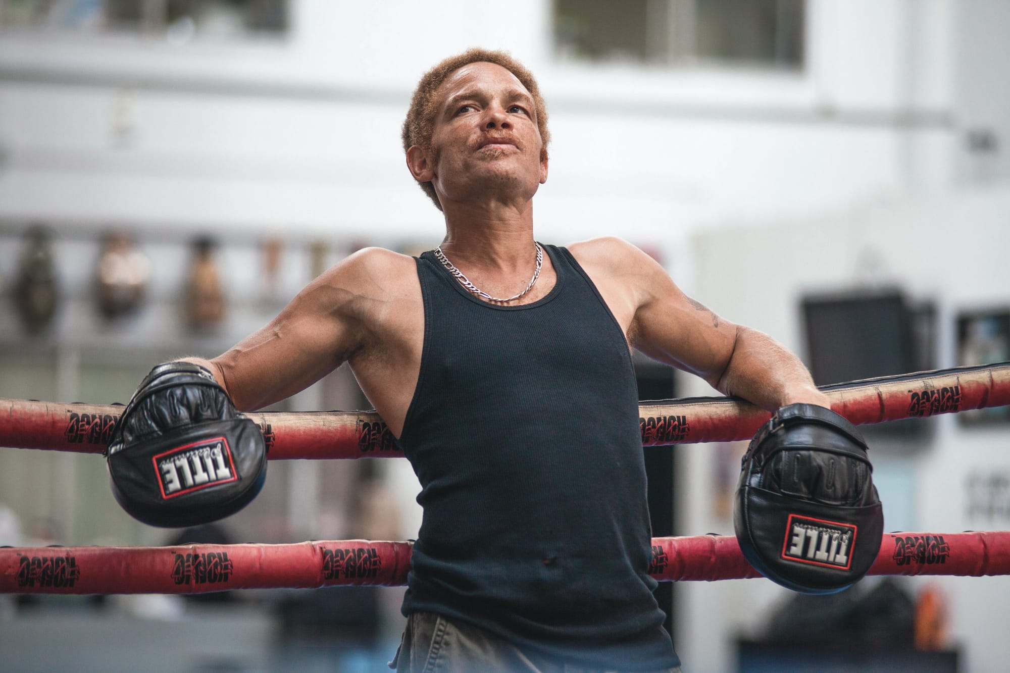 Paris Alexander, a former City College student who was on the college's boxing team, takes a breather on Wednesday, Sept. 3, while working as a boxing trainer at Fight and Fitness gym. (Photo by Nathaniel Y. Downes)