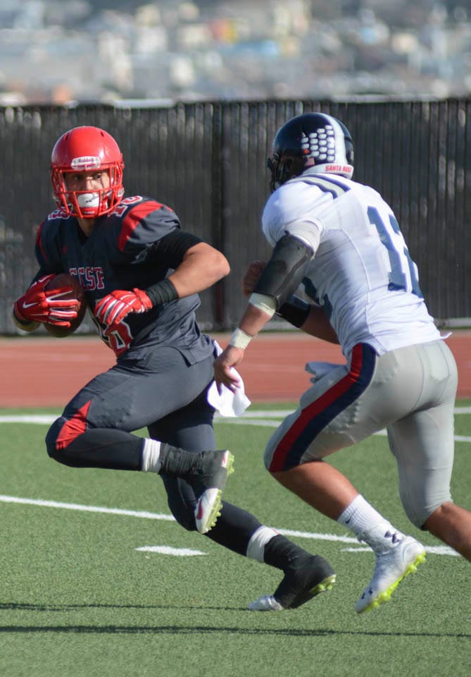 Cole Hikutini (18) sprints to the end zone to score a touchdown in the 3rd quarter of Saturday’s home game against Santa Rosa Junior College on October 25, 2014 (Photo by Niko Plagakis) 