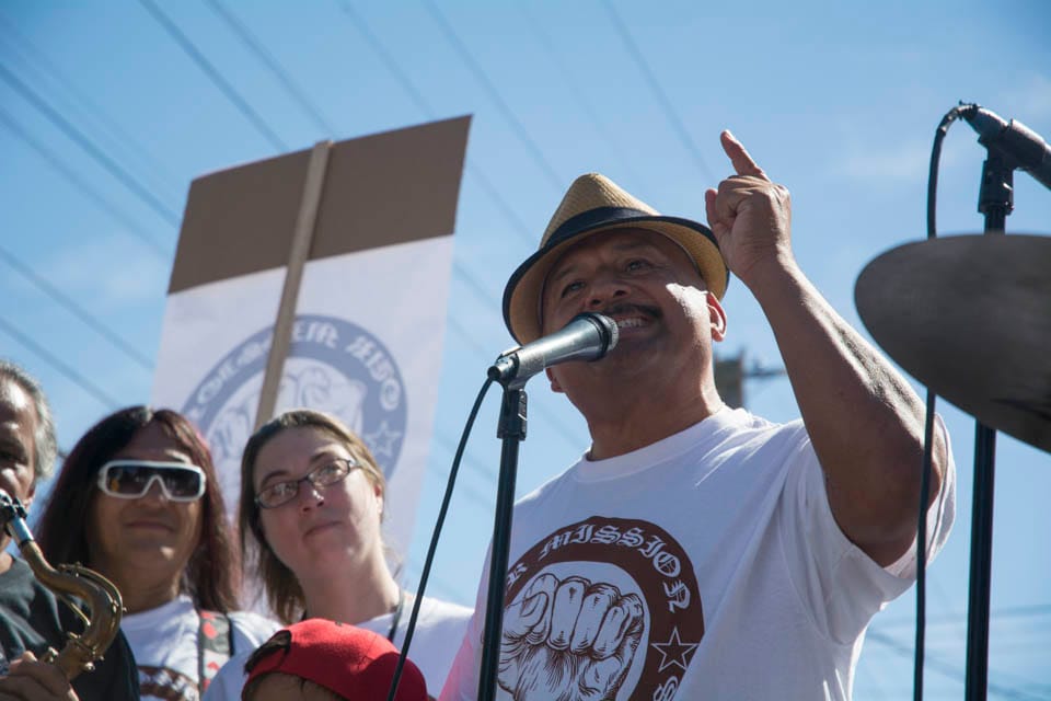 Roberto Hernadez, resident of San Francisco Mission District, and community activist speaks to demonstrators about Prop G, that will be on the ballots in the upcoming elections. “Prop G is our only hope to put a moratorium on evictions, stop the bleeding, and stop wiping out the Native San Franciscans.” He stated on Saturday Oct. 4, 2014,  in San Francisco, Calif. (Photo by Niko Plagakis) 