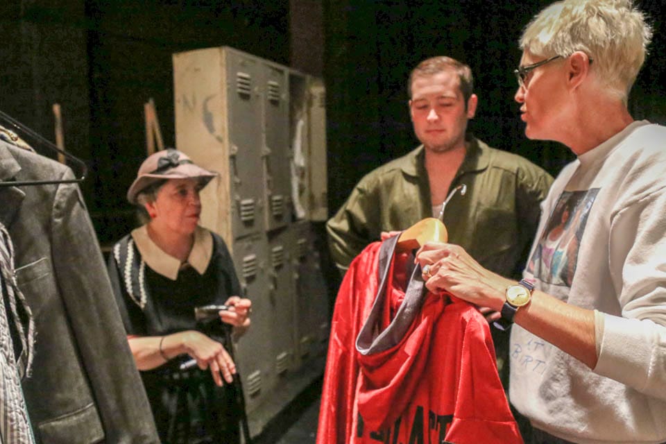 Susan Jackson coordinates actors backstage in Diego Rivera Theatre on Nov. 5.  (Photo by Natasha Dangond)