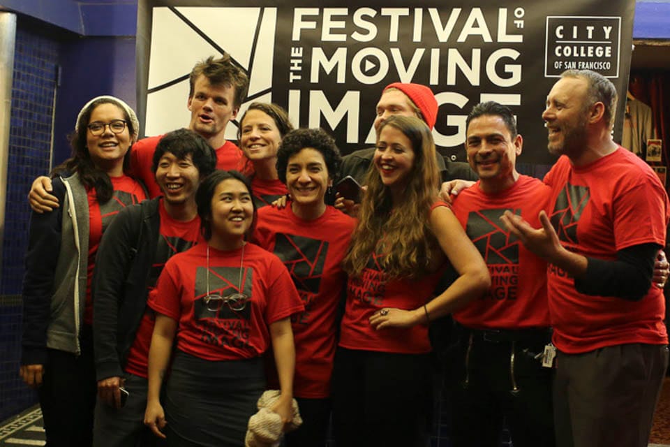 Festival of the Moving Image crew members gather in front of the theater.  (Photo by Natasha Dangond)
