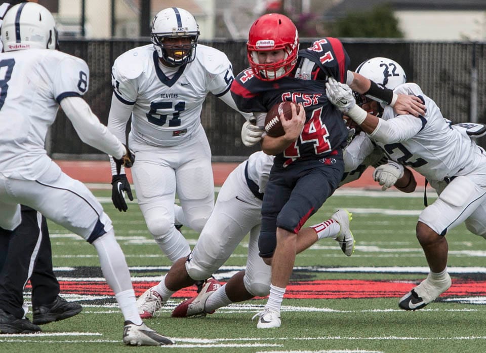 Rams quarterback Jeramiah Peralta(14) breaks tackles and scrambles with the ball during a football game against the American River College Beaver, Nov. 29. (Photo by Khaled Sayed) 