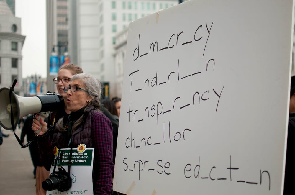 Organizers teach “spelling lesson” to crowd of demonstrators on Jan. 16, 2015 at the steps of City Hall. (Photo by Otto Pippenger)