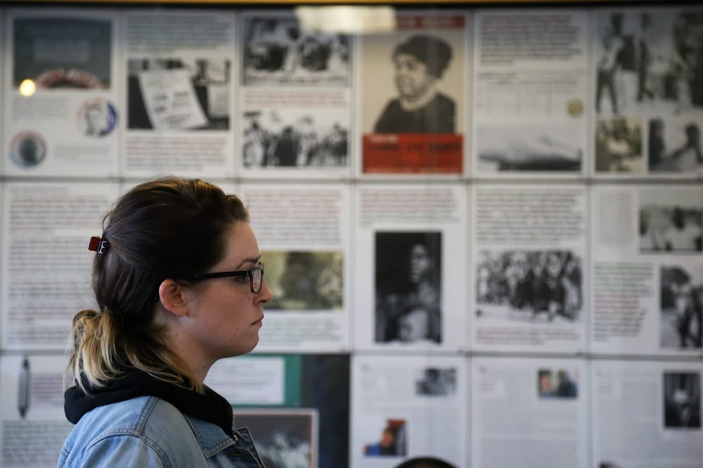 City College students gather in Conlan Hall to view the photo exhibition: “From ‘Mississippi Freedom Summer 1964’ to ‘Hands Up Don’t Shoot, Ferguson 2014’: Battling the ‘Old Jim Crow’ and the ‘New Jim Crow’” in Conlan Hall on Thursday, Jan. 29 at Ocean Campus. (Photo by Natasha Dangond)