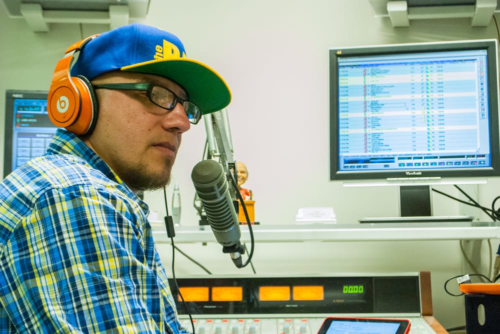 Program Director and “Da Mad- dHouze” radio show host Luis “DEZZ” Mendez during his radio show for KCSF on Ocean Campus, Monday, March 9. (Photo by Patrick Tamayo)