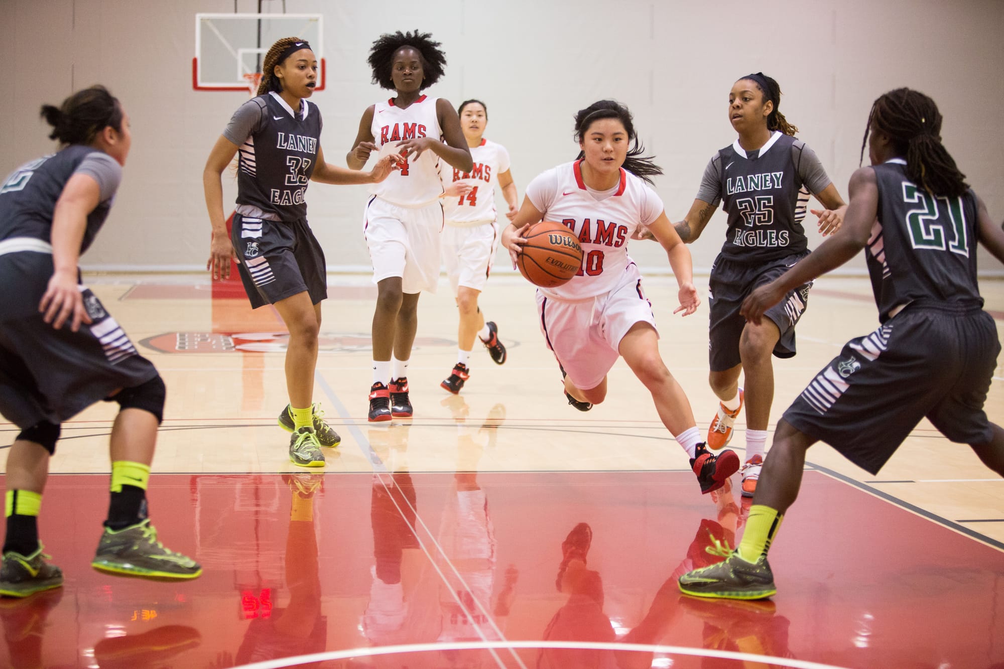 City College Freshman Cassidy Chan (10) trying to break through Laney College defense, Saturday, Feb. 28. (Photo by Khaled Sayed)