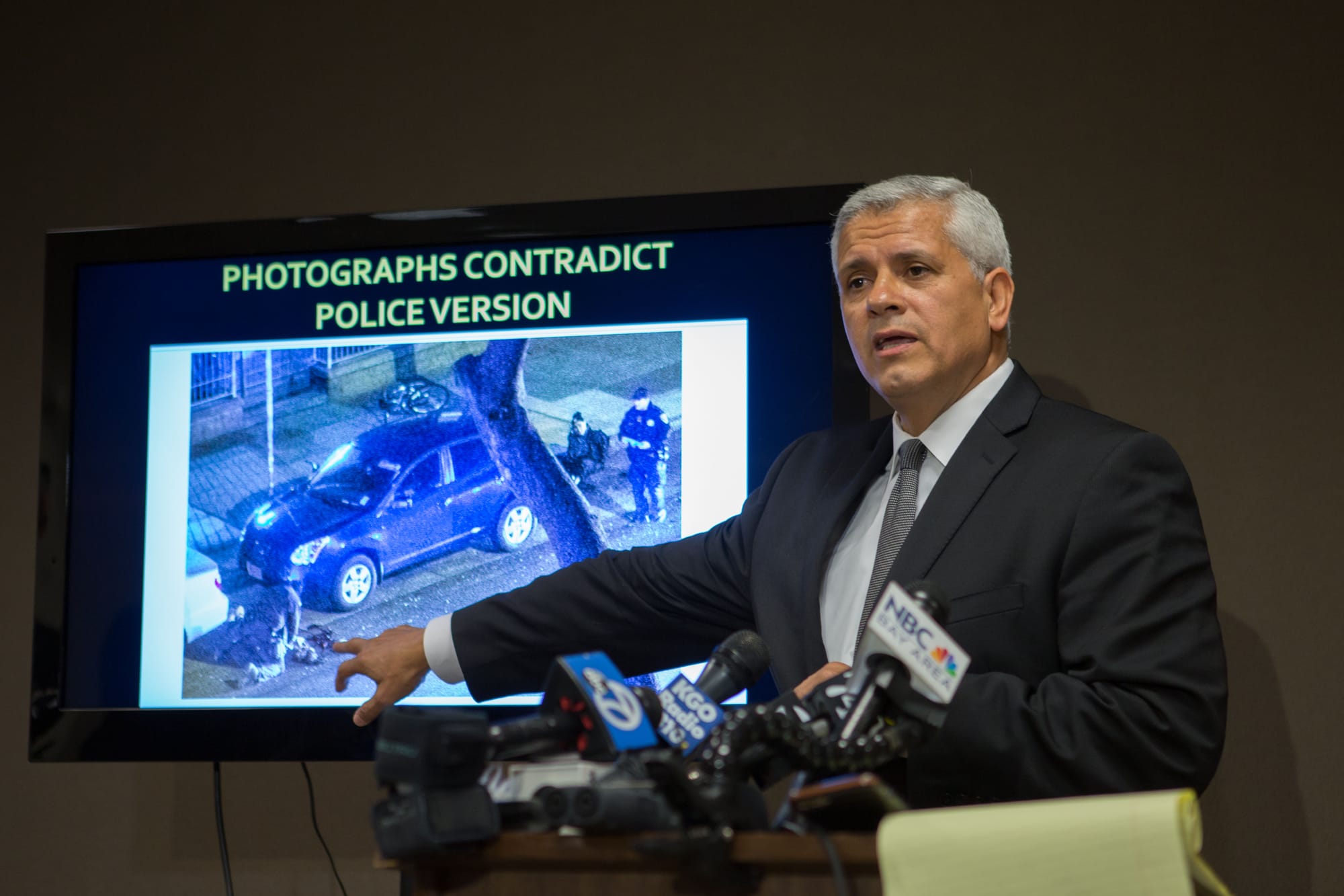 Arnaldo Casillas, Amilcar Perez-Lopez's attorney, showing crime scene and autopsy evidence at a news conference  April 25, 2015 San Francisco, CA ( photo by Khaled Sayed) 