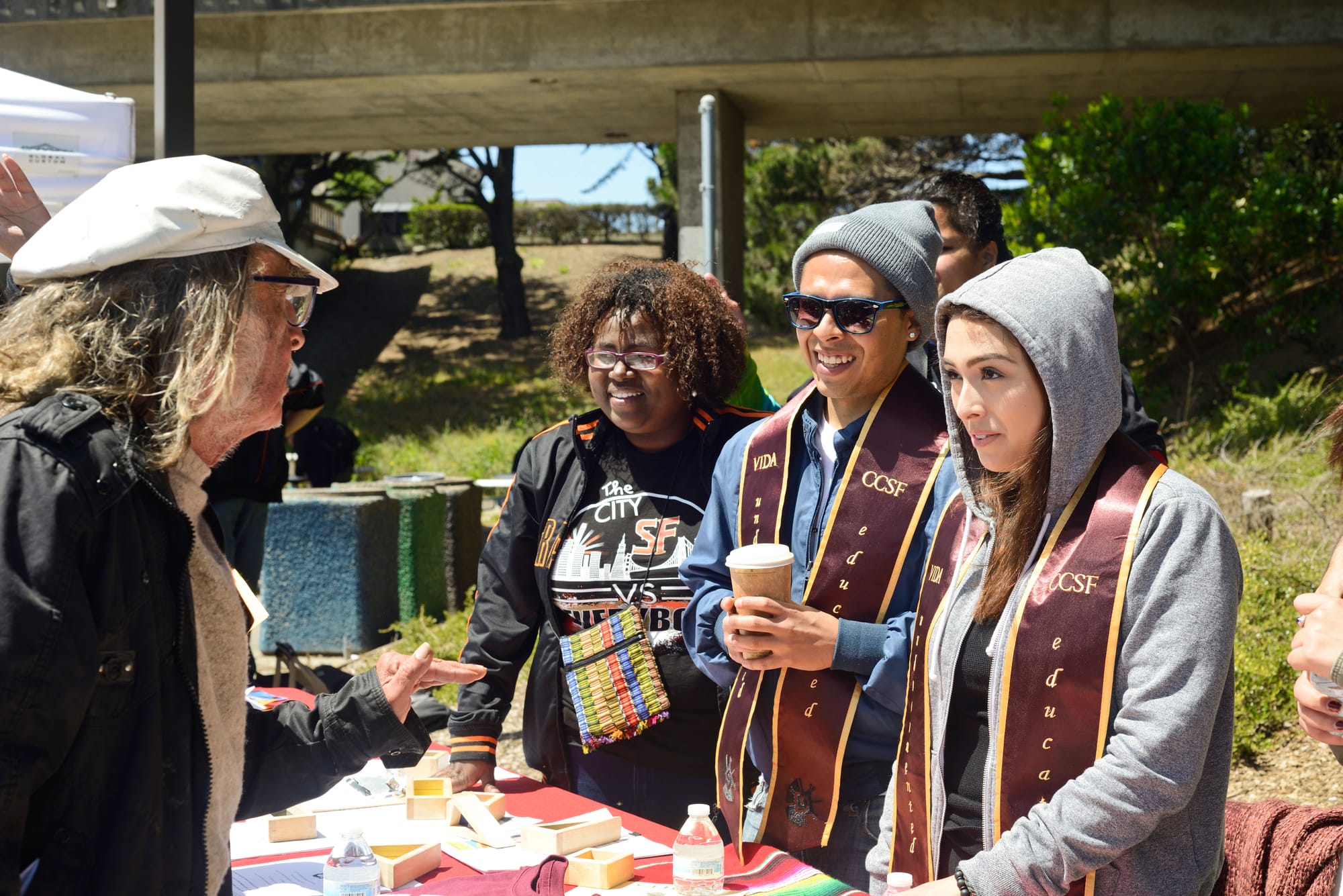 Alma Ramos helps out student and hands out information on Deferred Action for Childhood Arrivals (DACA) eligibility on Frisco Day at City College on Friday April 24, 2015. 