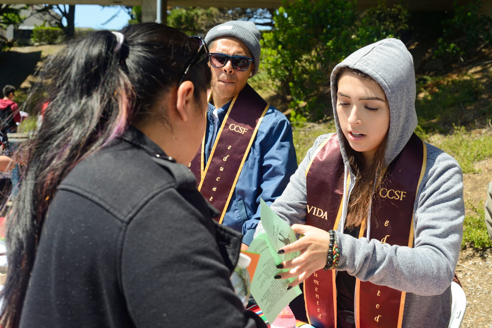 Alma Ramos helps out student and hands out information on Deferred Action for Childhood Arrivals (DACA) eligibility on Frisco Day at City College on Friday April 24, 2015. 