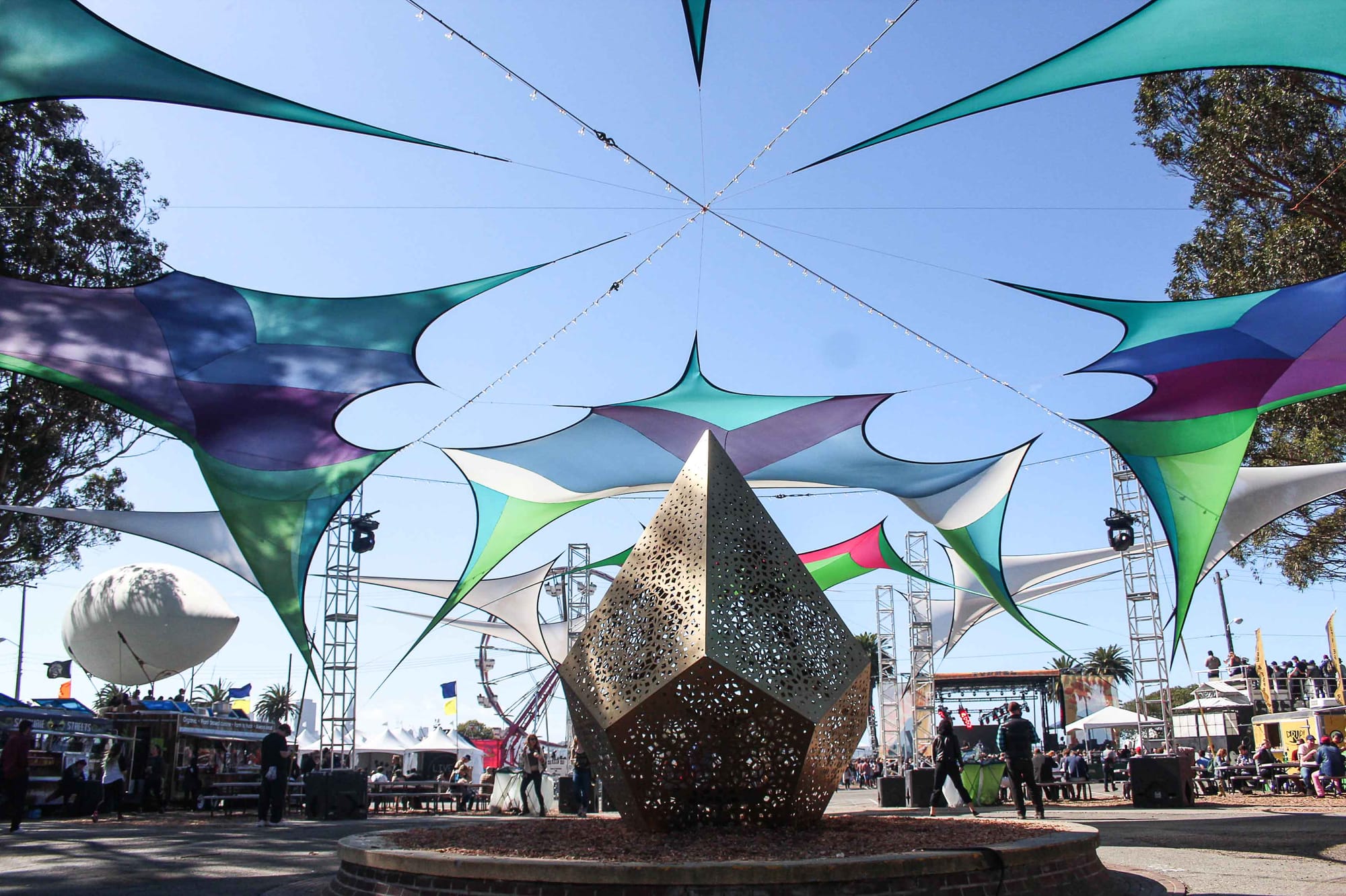 Metal sculpture and ceiling art installations above illuminate after nightfall. (Photo by Calindra Revier/The Guardsman)
