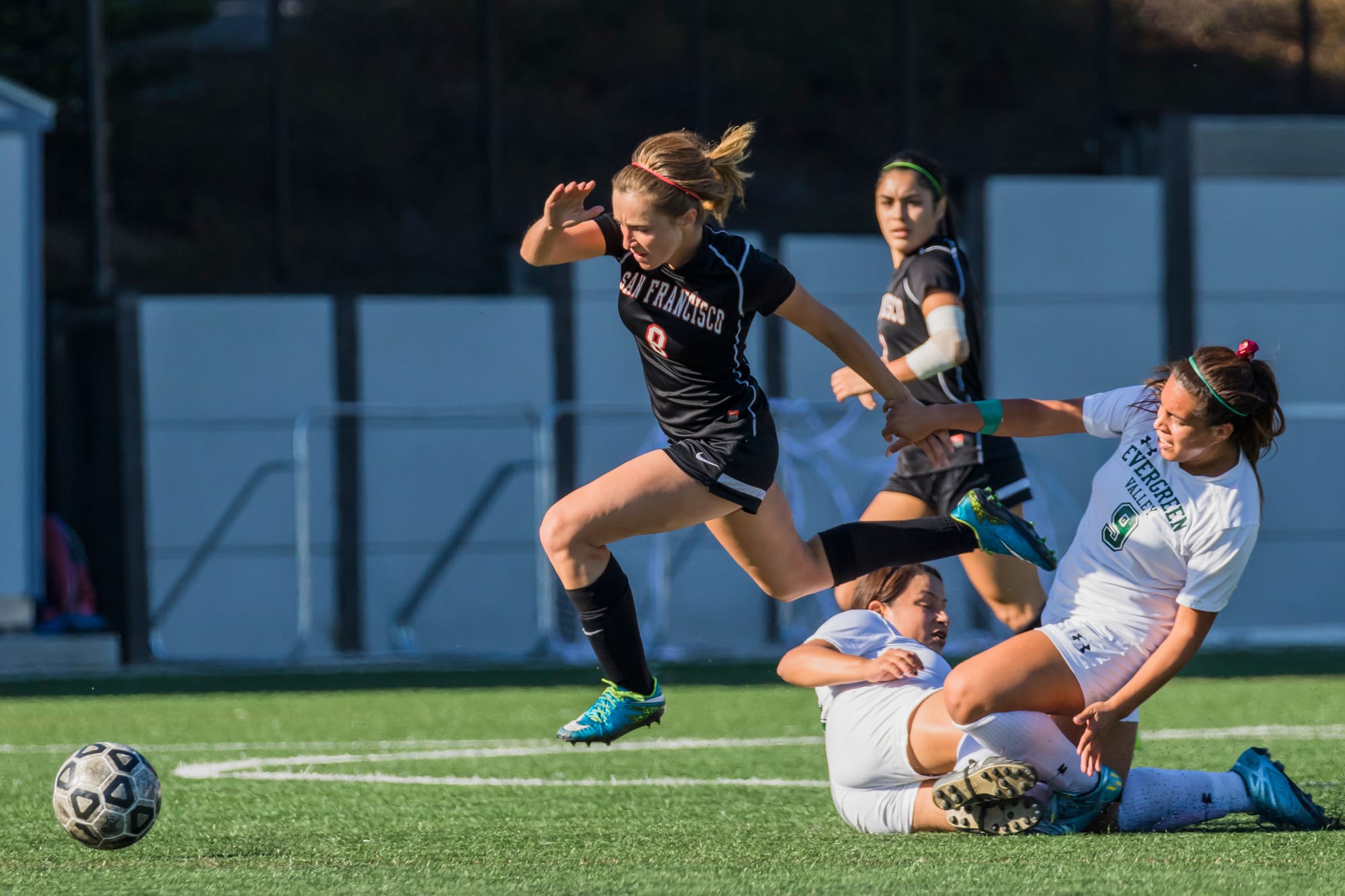 Freshman forward Jesse Bareilles launches over Evergreen College players in pursuit of the ball during City College’s final home game on Tuesday, Nov. 10 2015. (Photo by Peter Wong/The Guardsman)