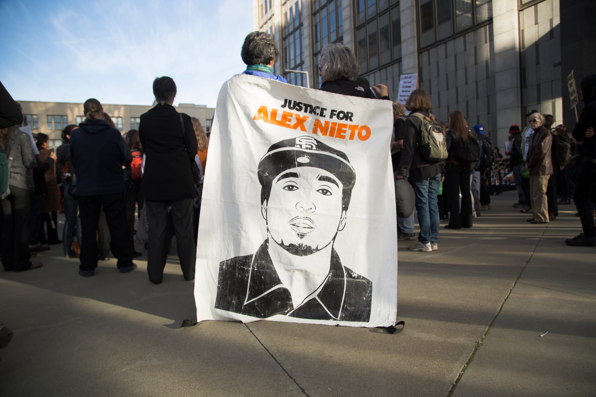 Supporters listen to a rally speaker at the at the Justice for Alex Nieto Walkout on Tues. March 1, 2016. (Gabriella Angotti-Jones / The Guradsman)March 1, 2016.