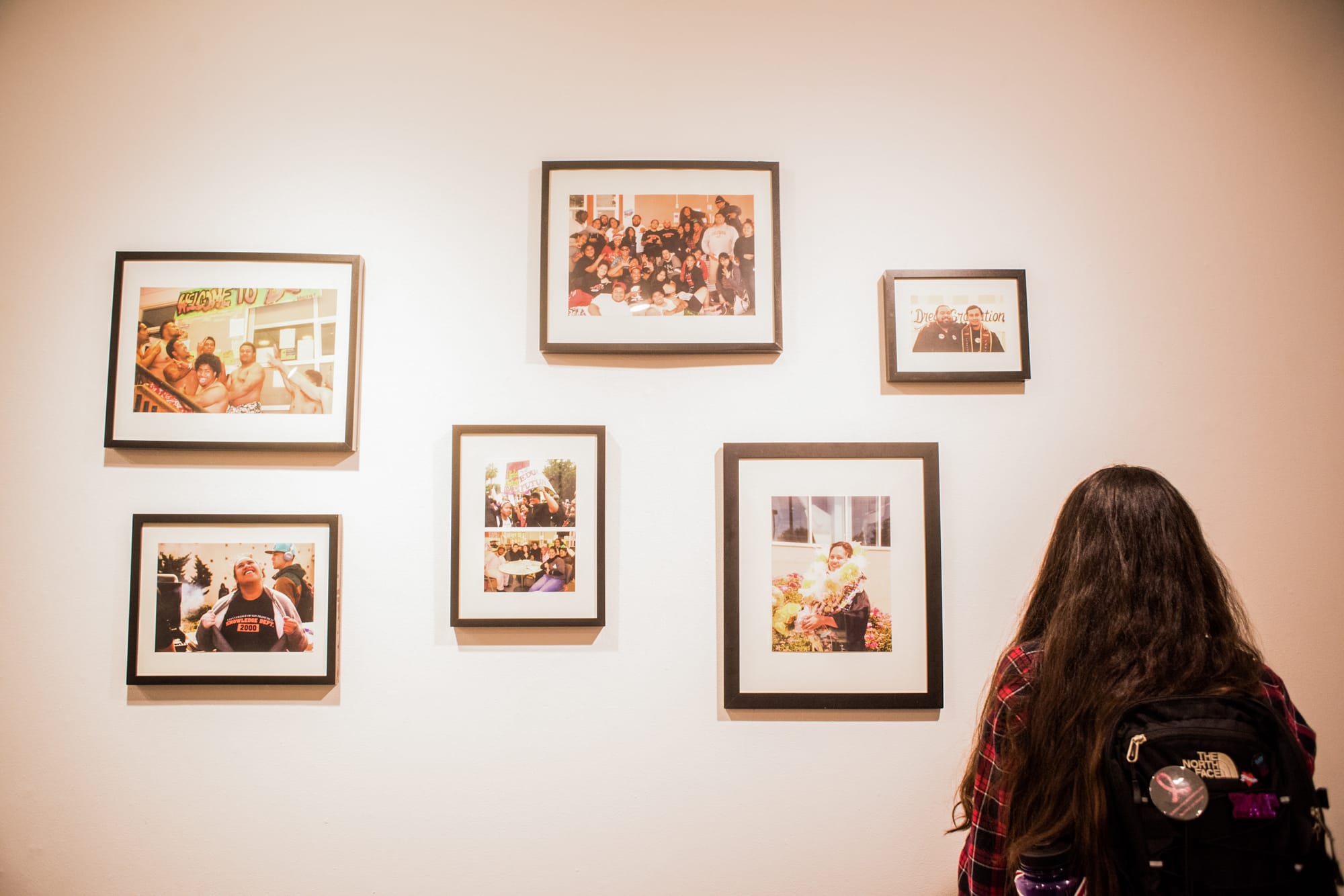 Public looks art exhibited in the Being Pacific Opening reception at San Francisco State University on Oct. 13, 2016. Photo by Gabriela Reni/ The Guardsman.