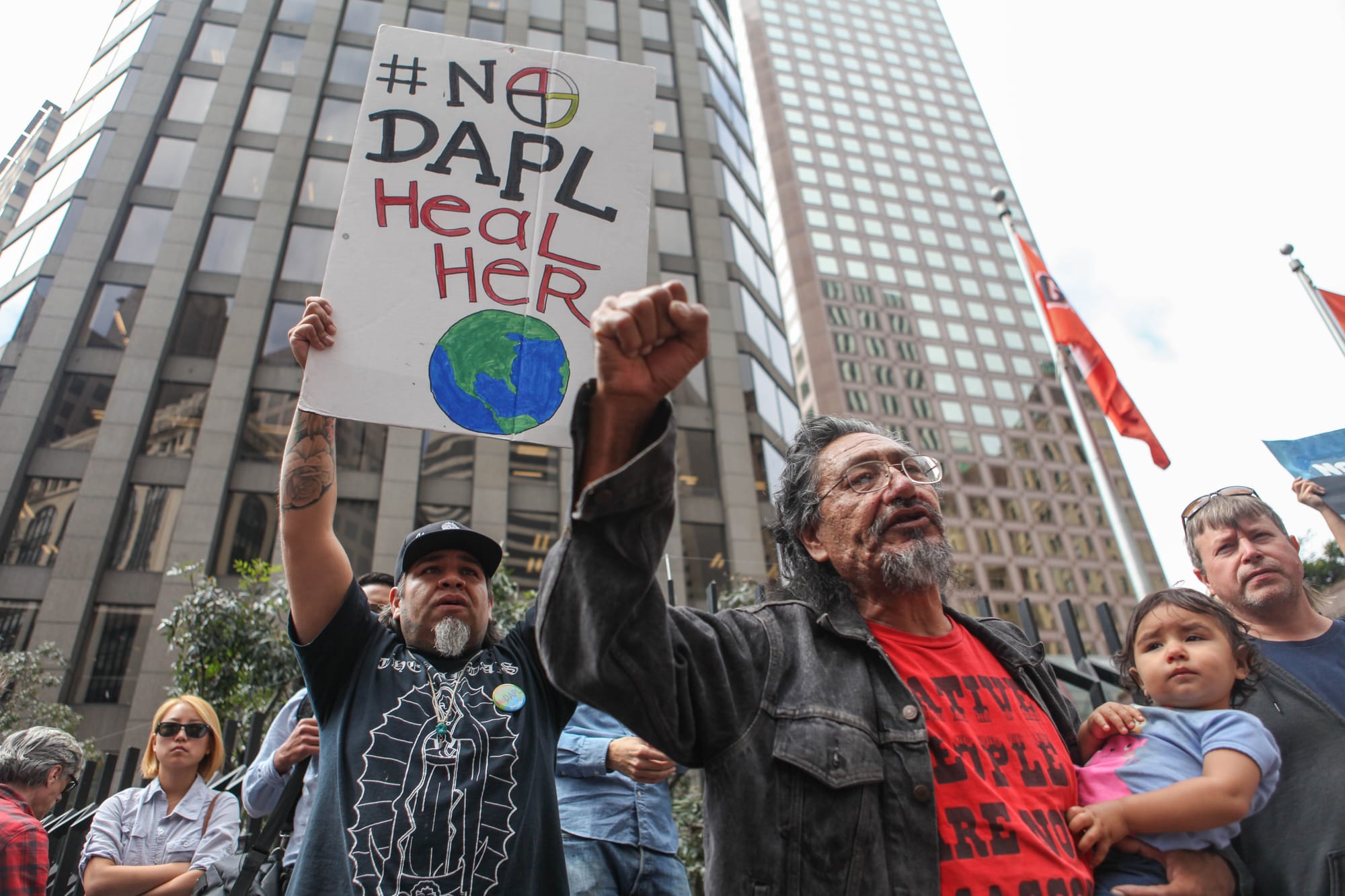 Native American activist William Underbaggage holds his daughter, Chante Tinza Winyan, 16 months old, in the Financial District on Sept/ 8. 2016 in protest against the Dakota Acces Pipeline project. Underbaggage is fighting for clean water for his daughter and for more generations to come. (Photo by Cassie Ordonio/The Guardsman)