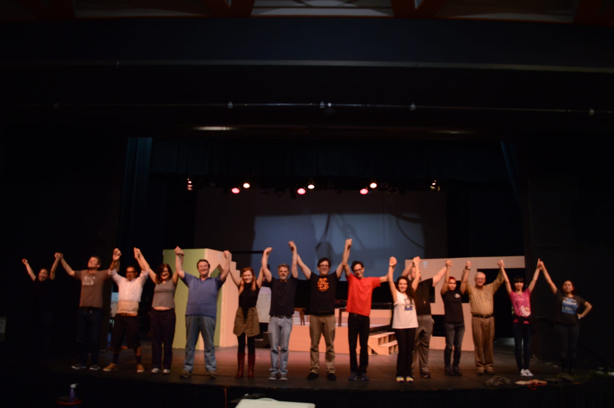  Cast and crew lock hands on stage after rehearsing scenes for Shakespeare’s “Twelfth Night.” Photo by Isela Vazquez/ The Guardsman 