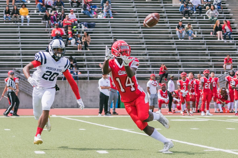 Wide receiver Tyrese Mack reaches out for receptions while being covered by American River defender. Photo taken on Sept. 16, 2017 by Peter Wong. 
