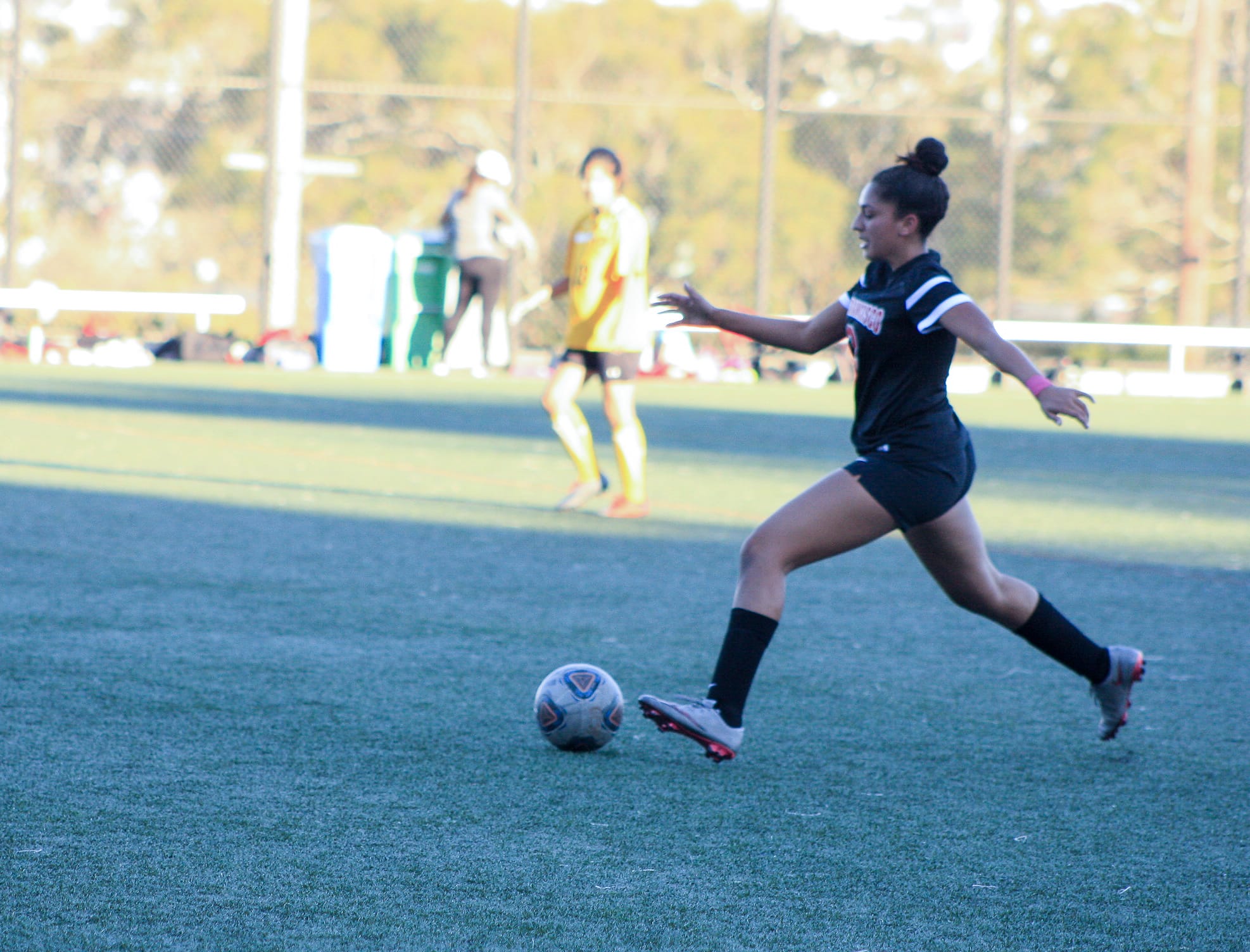 Angelica Gonzalez (#11) of City College goes in for a striking kick against Chabot’s player Isabella Cruz (#22) who attempts to steal the ball from Gonzalez. October 6, San Francisco, (AP Photo/ Julia Fuller) 