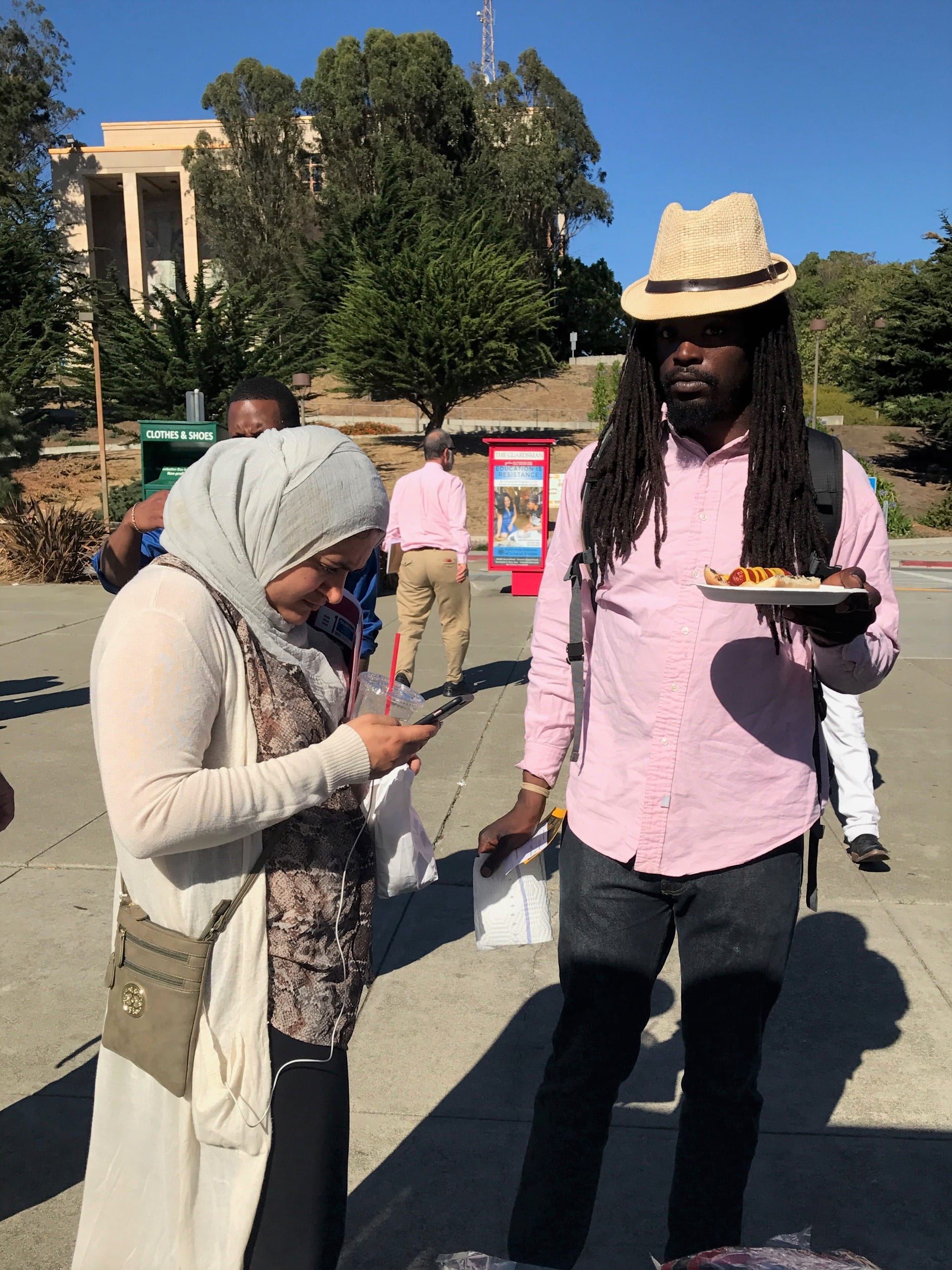 Two CCSF Students visit the Entreneurship Kiosk in the Ram Plaza on Ocean Campus to purchase food and drinks. Thursday, Oct. 26, 2017. The money raised will benefit the club and be able to fund their projects. San Francisco. (Photo by Diane Carter)