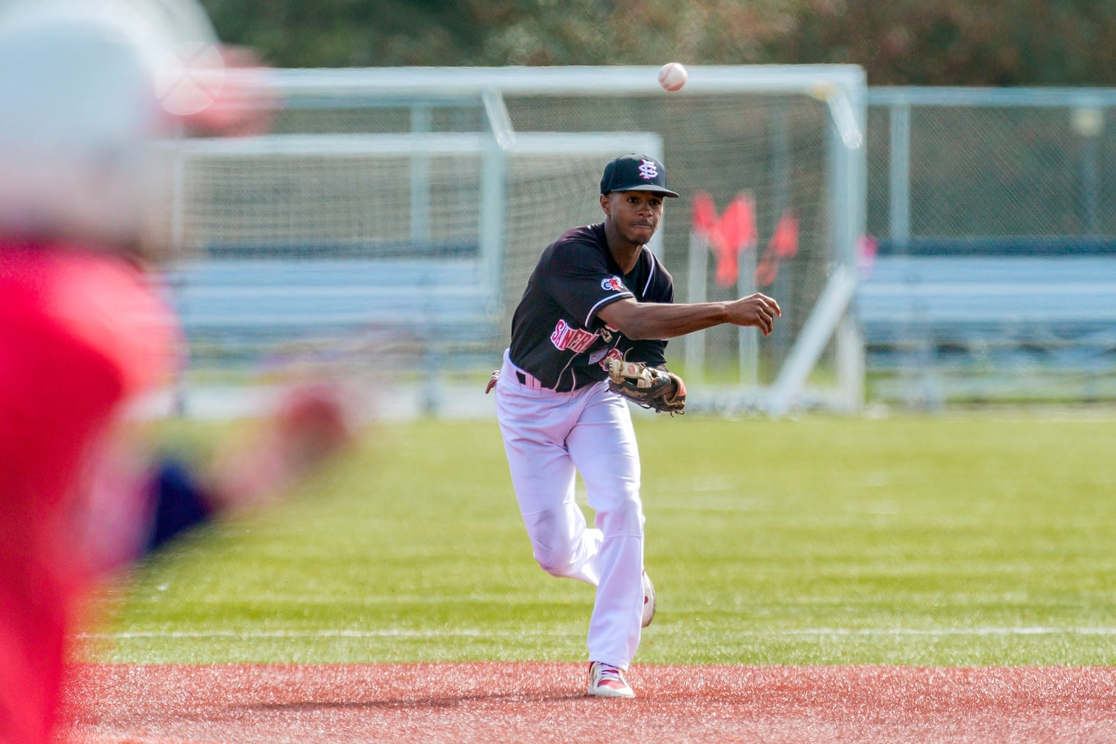 The Rams sophomore shortstop Justin T. Robinson (#4) throws out Siskiyous College runner at first base on Feb. 10, 2018. Photo by Eric Sun/special to The Guardsman.