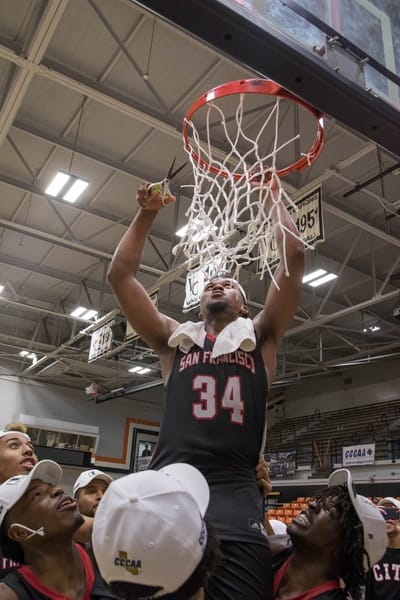 After defeating San Diego City College, the Rams' sophomore guard Michael Wright (#55), forward Lewis Hayes (#34), freshman guard Niamey Harris (#3), sophomore Ben Borja (#24), and Head Coach Justin Labagh are hoisted for the ceremonial cutting of the net on March 13, 2018. Photos by Felix Cortez/Special to The Guardsman.