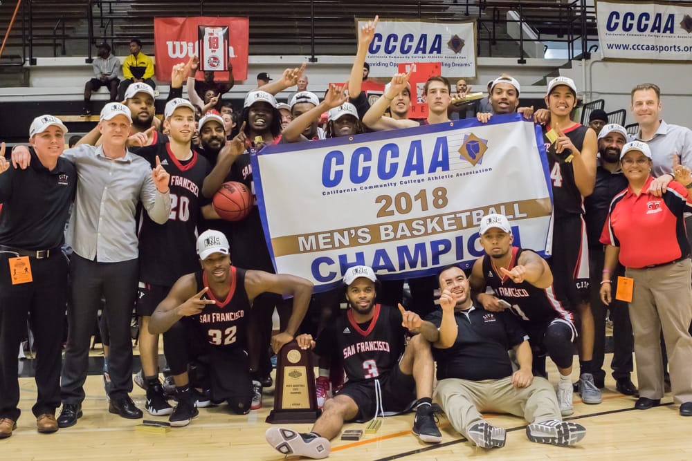 The Rams gather around CCCAA banner after winning 2018 State Title in Ventura, March 13, 2018. Photo by Peter Wong/Special to The Guardsman.