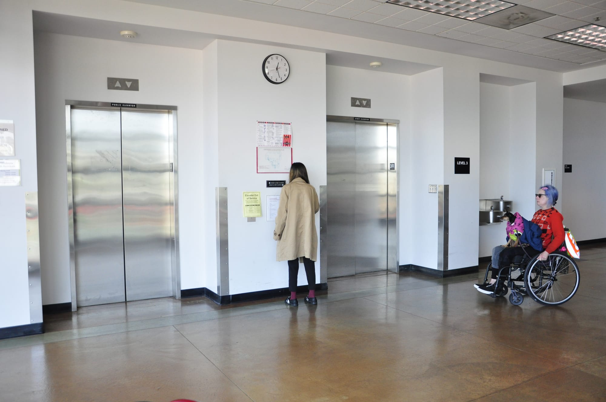 City College Student Natsui Sarah Gosney (right) waits for a staff member with a key to escort her on the staff elevator of the Rosenberg Library on March 1, 2018. Photo by Janeth R. Sanchez/The Guardsman. 