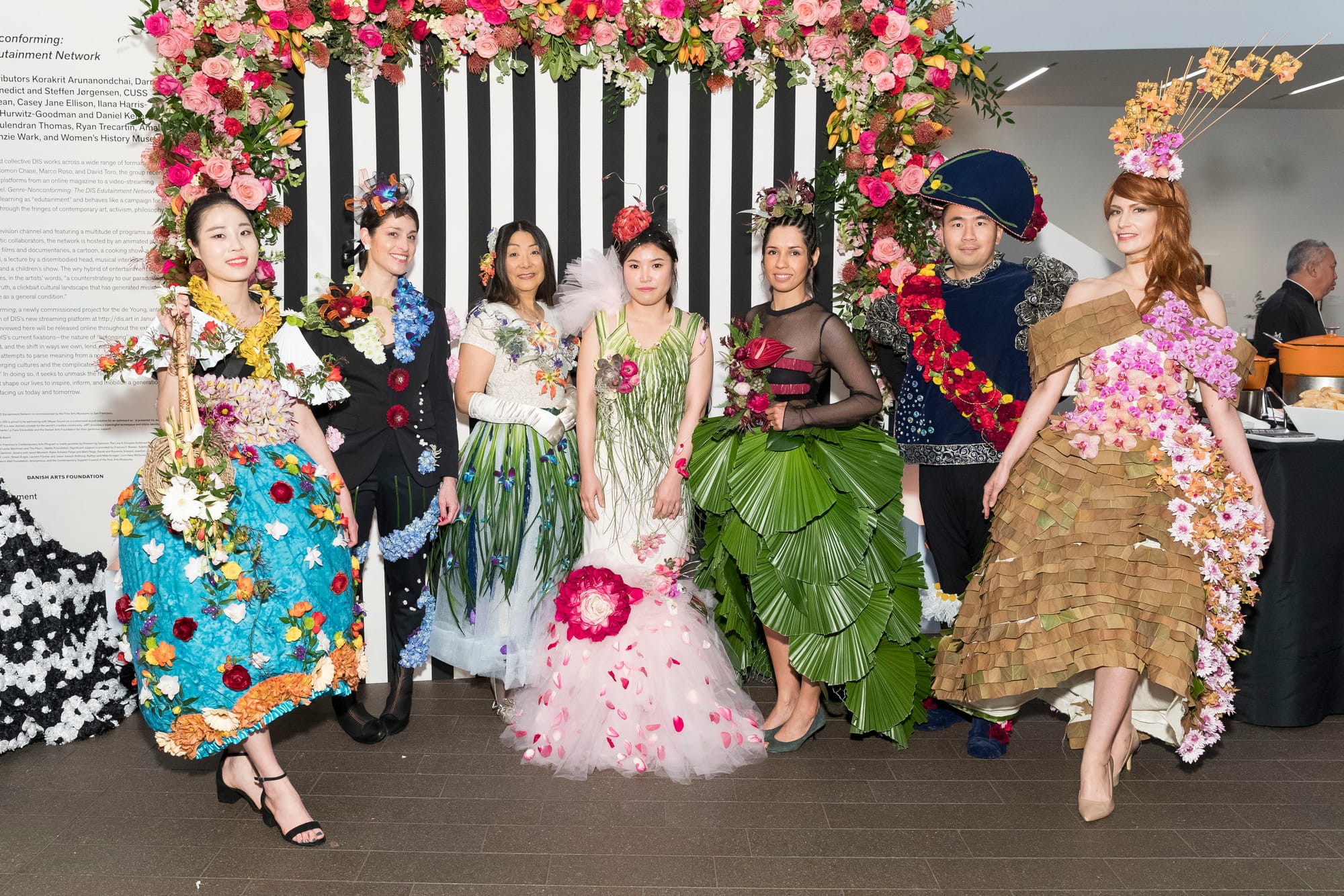 L to R: Junghwa Han, Betsy Herczeg-Konecney, Lina Woo, Yoeng Sum Park, Liberty S. Velez, Sam Lee, and Natalia Wierzba model the designs of City College floristry students Dahee Han, Shari Wilk, Lina Woo, Bora Yoo, Rosa Mendoza, Summer Kwak, and Armando de Loera Mejia respectively on March 12, 2018. Photo by Drew Altizer/Courtesy of the Fine Arts Museum of San Francisco.