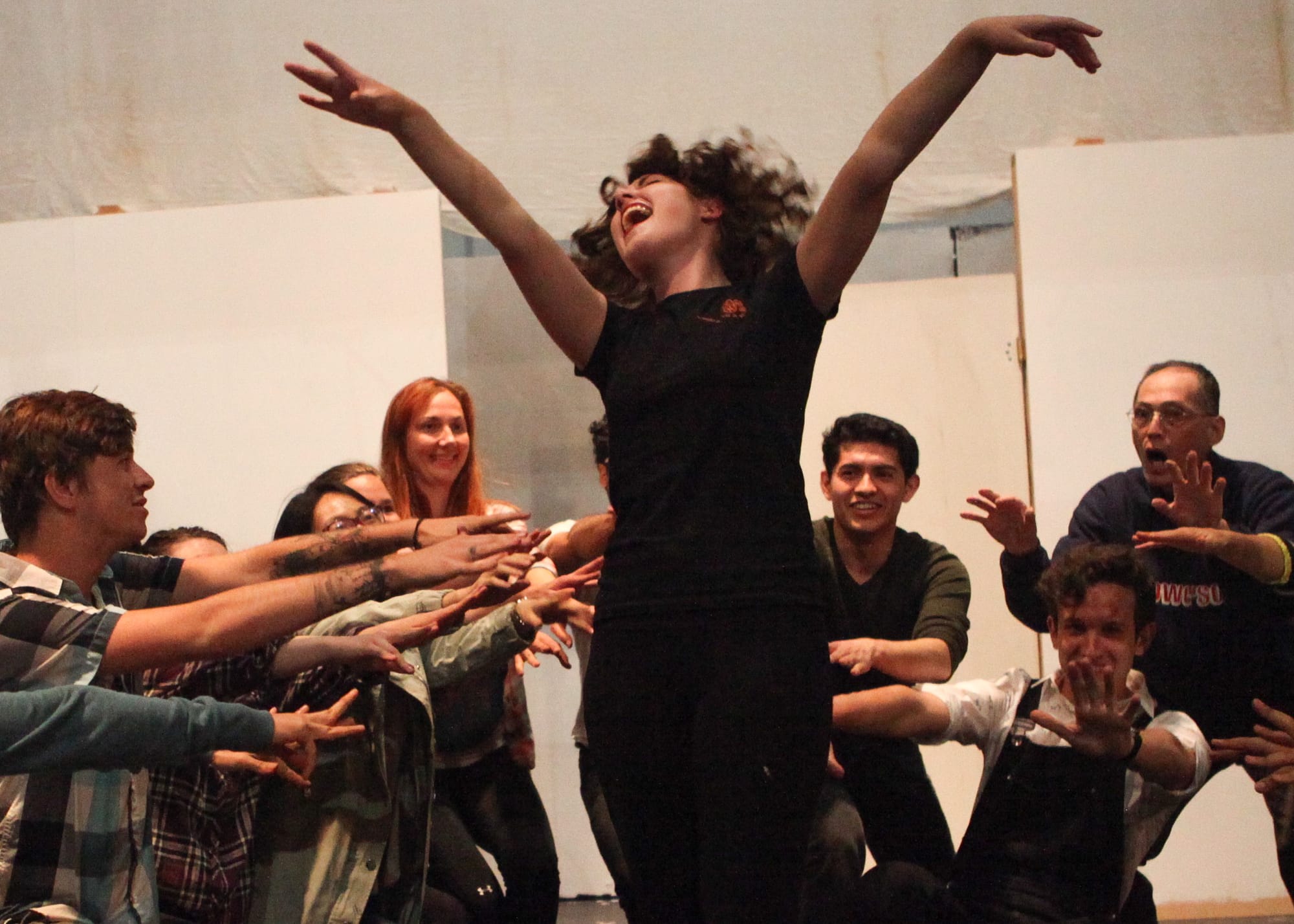 Amanda Delucchi (center) sings center stage during a rehearsal at Diego Rivera Theatre on April 2, 2018. Photo by Cassie Ordonio/Special to The Guardsman