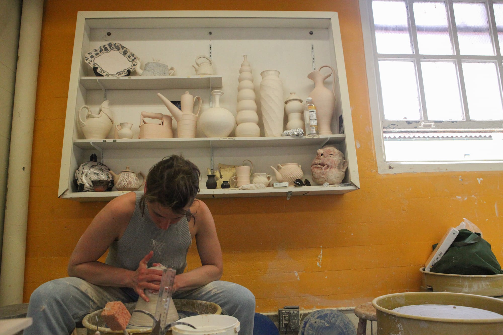Anastasia Tumanova works on her ceramics piece at City College's Fort Mason Campus on April 7, 2018. Photo by Cassie Ordonio/The Guardsman.
