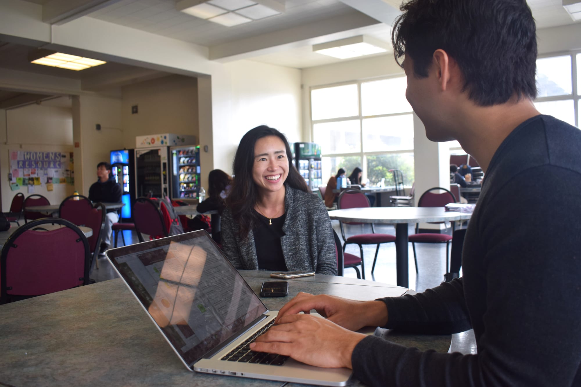 Media Relations Director Connie Chan (left) speaks to The Guardsman's news editor David Mamaril Horowitz (right) about her role at City College. Photo by Sarah Berjan/The Guardsman