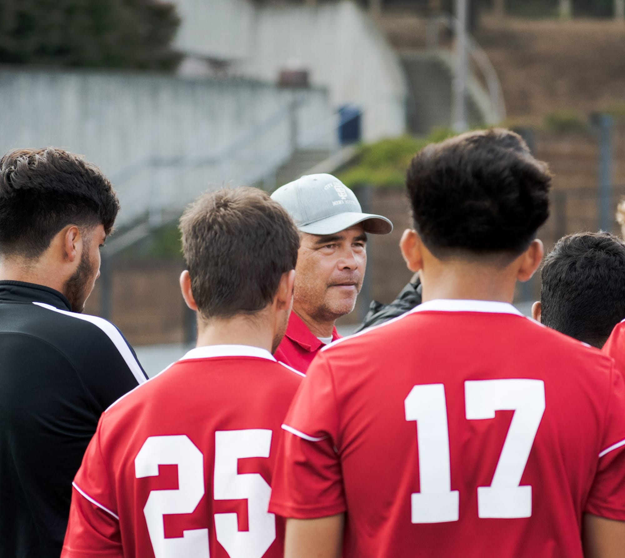 Head Coach, Adam Lucarelli, address’ the team at the end of the game. Photo by Cliff Fernandes/The Guardsman